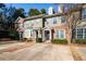 Brick front exterior of townhome with 2-car driveway at 2116 Del Lago Nw Cir # 3, Kennesaw, GA 30152