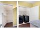 Convenient laundry room with shelving and washer/dryer hookups at 2116 Del Lago Nw Cir # 3, Kennesaw, GA 30152