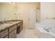 Bathroom with granite vanity and bathtub at 272 Mckenzie Dr, Stockbridge, GA 30281
