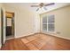Bright bedroom with wood floors, ceiling fan and ensuite bathroom at 272 Mckenzie Dr, Stockbridge, GA 30281