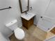Updated bathroom with single vanity, toilet and tile flooring at 1612 Alexandria Se Ct, Marietta, GA 30067