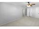 Large bedroom with ceiling fan, carpet, and mirrored closet doors at 1612 Alexandria Se Ct, Marietta, GA 30067