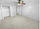 Spacious bedroom with neutral carpeting and ample closet space at 1612 Alexandria Se Ct, Marietta, GA 30067