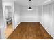 Simple dining area with hardwood floors and a view of the bathroom at 1612 Alexandria Se Ct, Marietta, GA 30067