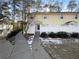 Inviting yellow house exterior with a white fence and walkway at 1612 Alexandria Se Ct, Marietta, GA 30067