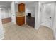 Kitchen features wood cabinets, granite countertops and tile floor at 1612 Alexandria Se Ct, Marietta, GA 30067