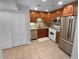 Modern kitchen with stainless steel appliances and wood cabinets at 1612 Alexandria Se Ct, Marietta, GA 30067