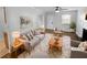 Virtually staged living room featuring hardwood floors and a cozy fireplace at 1612 Alexandria Se Ct, Marietta, GA 30067