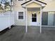 Private patio with adjacent door and sliding glass door at 1612 Alexandria Se Ct, Marietta, GA 30067