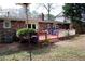 Red deck with white railing and landscaping at 2499 Little John Se Trl, Marietta, GA 30067
