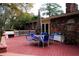 Brick house with large deck and patio furniture at 2499 Little John Se Trl, Marietta, GA 30067