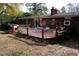 Large deck with brick house in background at 2499 Little John Se Trl, Marietta, GA 30067