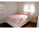 Bedroom with hardwood floors and a queen bed at 2499 Little John Se Trl, Marietta, GA 30067