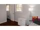 Bedroom with hardwood floors, dresser, and a bed at 2499 Little John Se Trl, Marietta, GA 30067
