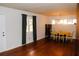 Hardwood floor dining room with a yellow tablecloth and chandelier at 2499 Little John Se Trl, Marietta, GA 30067