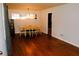 Dining room with hardwood floors, and a yellow table cloth at 2499 Little John Se Trl, Marietta, GA 30067