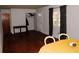Bright dining room with hardwood floors, yellow tablecloth, and built in hutch at 2499 Little John Se Trl, Marietta, GA 30067