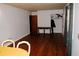 Spacious dining room with hardwood floors and a yellow tablecloth at 2499 Little John Se Trl, Marietta, GA 30067