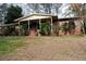 Brick ranch house with covered porch and landscaping at 2499 Little John Se Trl, Marietta, GA 30067