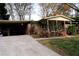 Brick ranch house with attached carport and landscaping at 2499 Little John Se Trl, Marietta, GA 30067