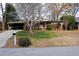 Ranch house with carport and landscaped yard at 2499 Little John Se Trl, Marietta, GA 30067