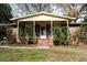 Brick front porch with steps, wrought iron railings, and landscaping at 2499 Little John Se Trl, Marietta, GA 30067