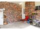 Brick garage with chair, storage, and tools at 2499 Little John Se Trl, Marietta, GA 30067