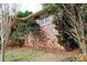Brick house exterior with landscaping and trees at 2499 Little John Se Trl, Marietta, GA 30067
