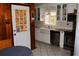 Updated kitchen with white cabinets, stainless steel appliances, and tiled floor at 2499 Little John Se Trl, Marietta, GA 30067