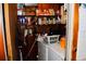 Small laundry room with washer, dryer, and storage shelves at 2499 Little John Se Trl, Marietta, GA 30067