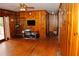Spacious living area with wood walls, hardwood floors, and a TV at 2499 Little John Se Trl, Marietta, GA 30067