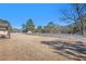 Large backyard with a pergola, white fence, and open space at 5024 Klondike Rd, Lithonia, GA 30038