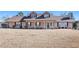 Two-story house with brown roof, porch, and landscaping at 5024 Klondike Rd, Lithonia, GA 30038