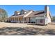 Two-story house with brown roof, porch, and detached shed at 5024 Klondike Rd, Lithonia, GA 30038