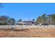 Ranch style home with a large backyard and white picket fence at 5024 Klondike Rd, Lithonia, GA 30038