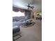 Spacious living room with large windows, carpet, and sofa at 5024 Klondike Rd, Lithonia, GA 30038