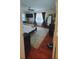 Large bedroom with hardwood floors, a bed and TV at 5024 Klondike Rd, Lithonia, GA 30038