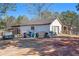 Detached outbuilding with garage door and storage at 5024 Klondike Rd, Lithonia, GA 30038