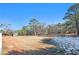 Open pasture with a barn and distant trees at 5024 Klondike Rd, Lithonia, GA 30038