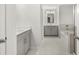 Bathroom with soaking tub, gray vanity, and tile flooring at 42 Parkview Dr, Dallas, GA 30157