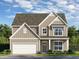 Two-story house with light brown siding, white trim, and a two-car garage at 42 Parkview Dr, Dallas, GA 30157