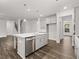 Island kitchen with stainless steel appliances and gray shaker cabinets at 42 Parkview Dr, Dallas, GA 30157