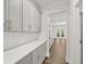 Kitchen features gray shaker cabinets, white quartz countertops, and a walk-in pantry at 42 Parkview Dr, Dallas, GA 30157