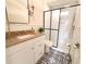 Updated bathroom with granite countertop, subway tile shower, and patterned floor at 1912 Canmont Ne Dr, Atlanta, GA 30319