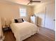 Cozy bedroom featuring a full bed, wood floors, and a ceiling fan at 1912 Canmont Ne Dr, Atlanta, GA 30319