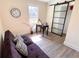 Bright bedroom with wood floors, a sliding barn door, and a workspace at 1912 Canmont Ne Dr, Atlanta, GA 30319