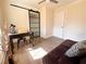 Bright bedroom with wood floors, a sliding barn door, and a workspace at 1912 Canmont Ne Dr, Atlanta, GA 30319