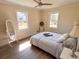 Spacious bedroom with wood floors, large windows, and a ceiling fan at 1912 Canmont Ne Dr, Atlanta, GA 30319