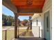 Covered porch with a view of the street and surrounding homes at 1912 Canmont Ne Dr, Atlanta, GA 30319