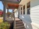 Covered front porch with modern metal railings and wooden flooring at 1912 Canmont Ne Dr, Atlanta, GA 30319